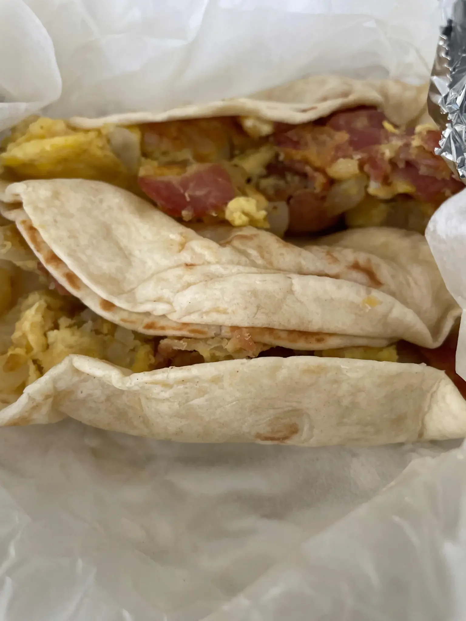 Bacon & Egg Taco - Crispy bacon with scrambled eggs in a flour tortilla
