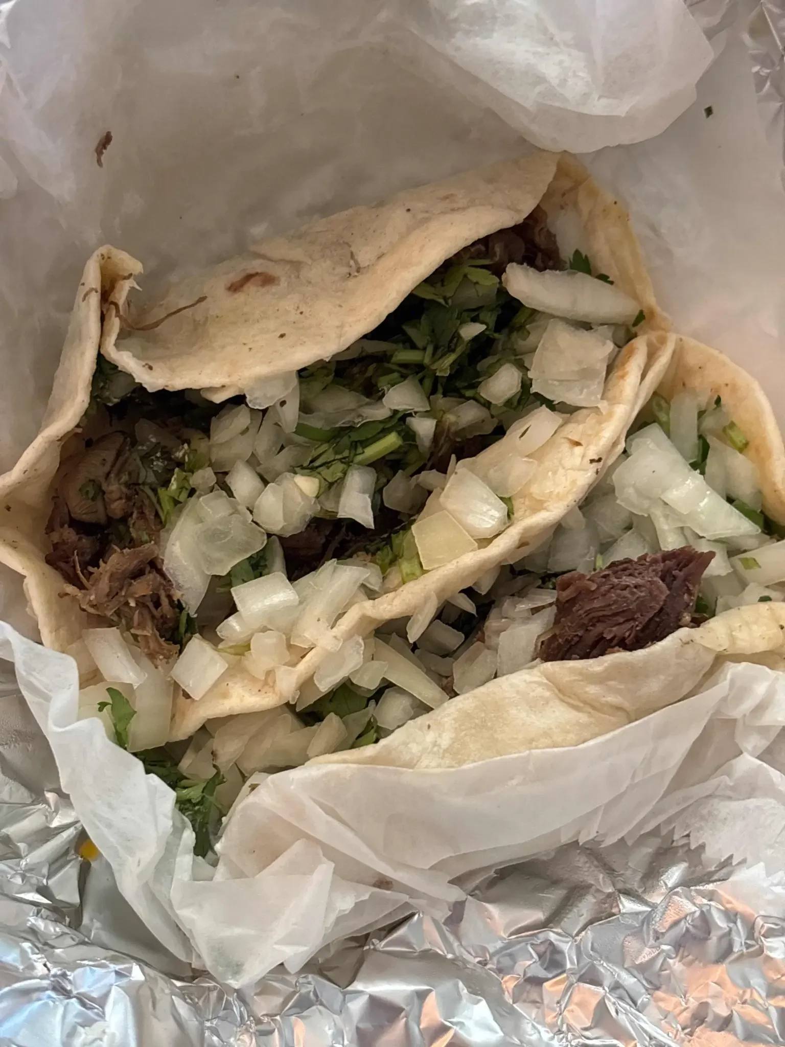 Barbacoa Taco - Slow-cooked beef barbacoa on a fresh corn tortilla