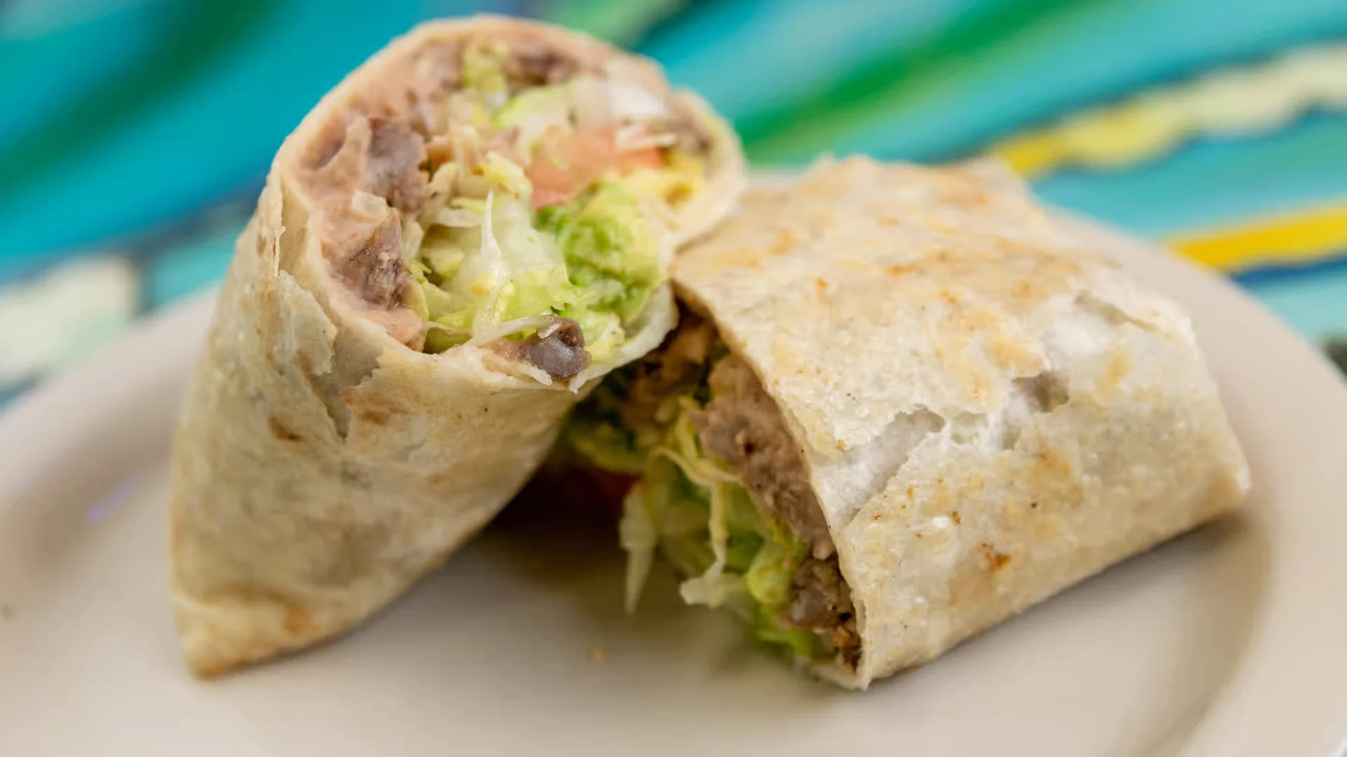 Burrito - Stuffed flour tortilla with your choice of meat, beans, and rice