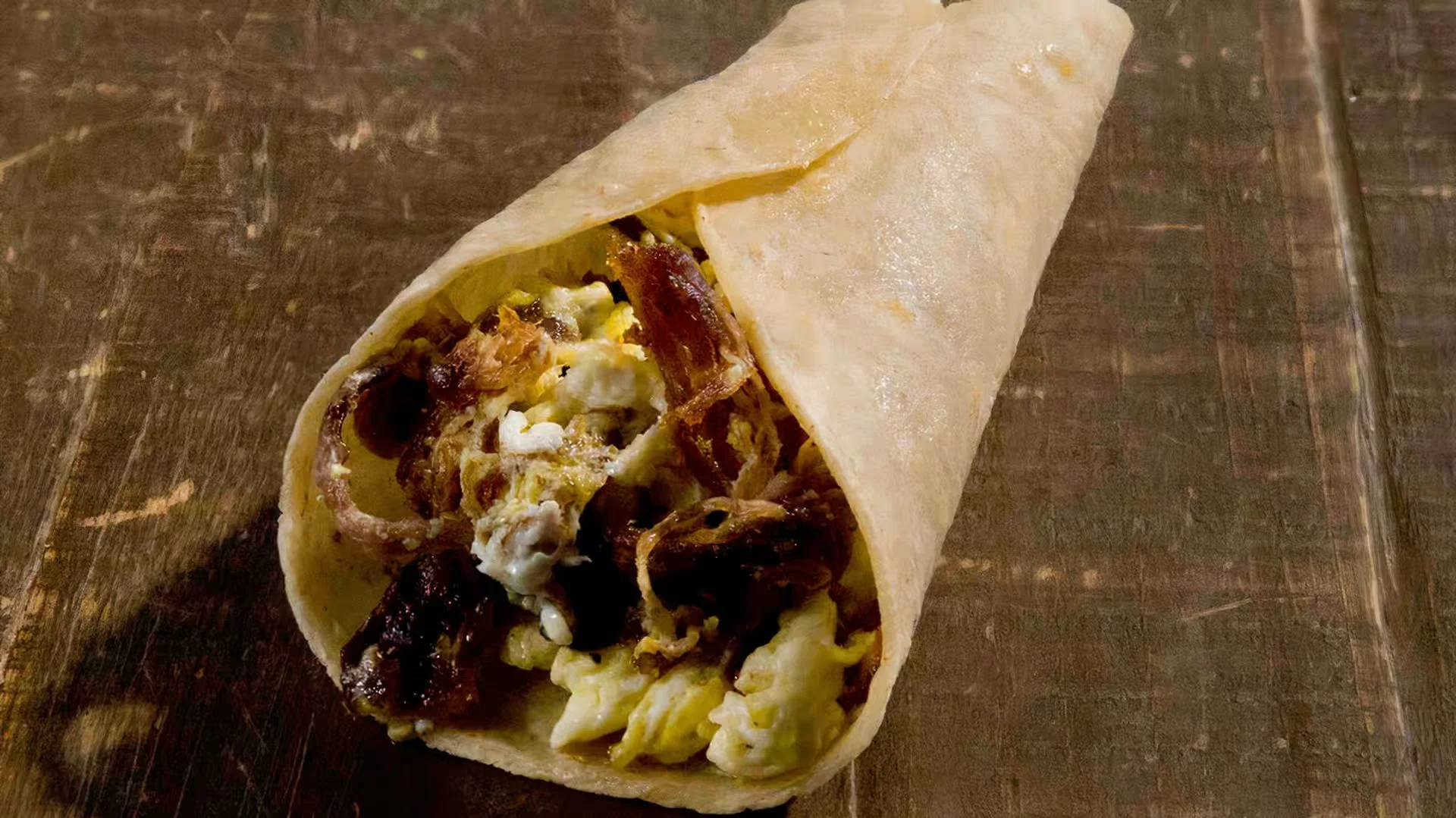 Machacado & Eggs Plate - Dried shredded beef scrambled with eggs, tomatoes, and jalapeños