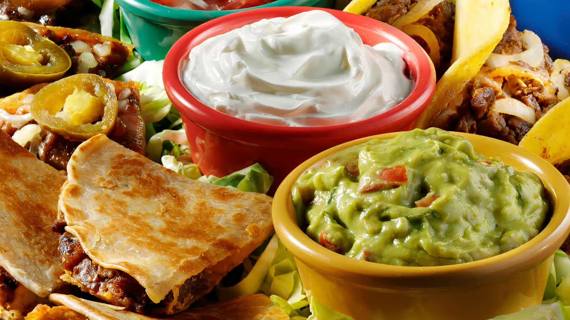 Plato Combinado - A hearty combination plate with enchiladas, rice, and beans