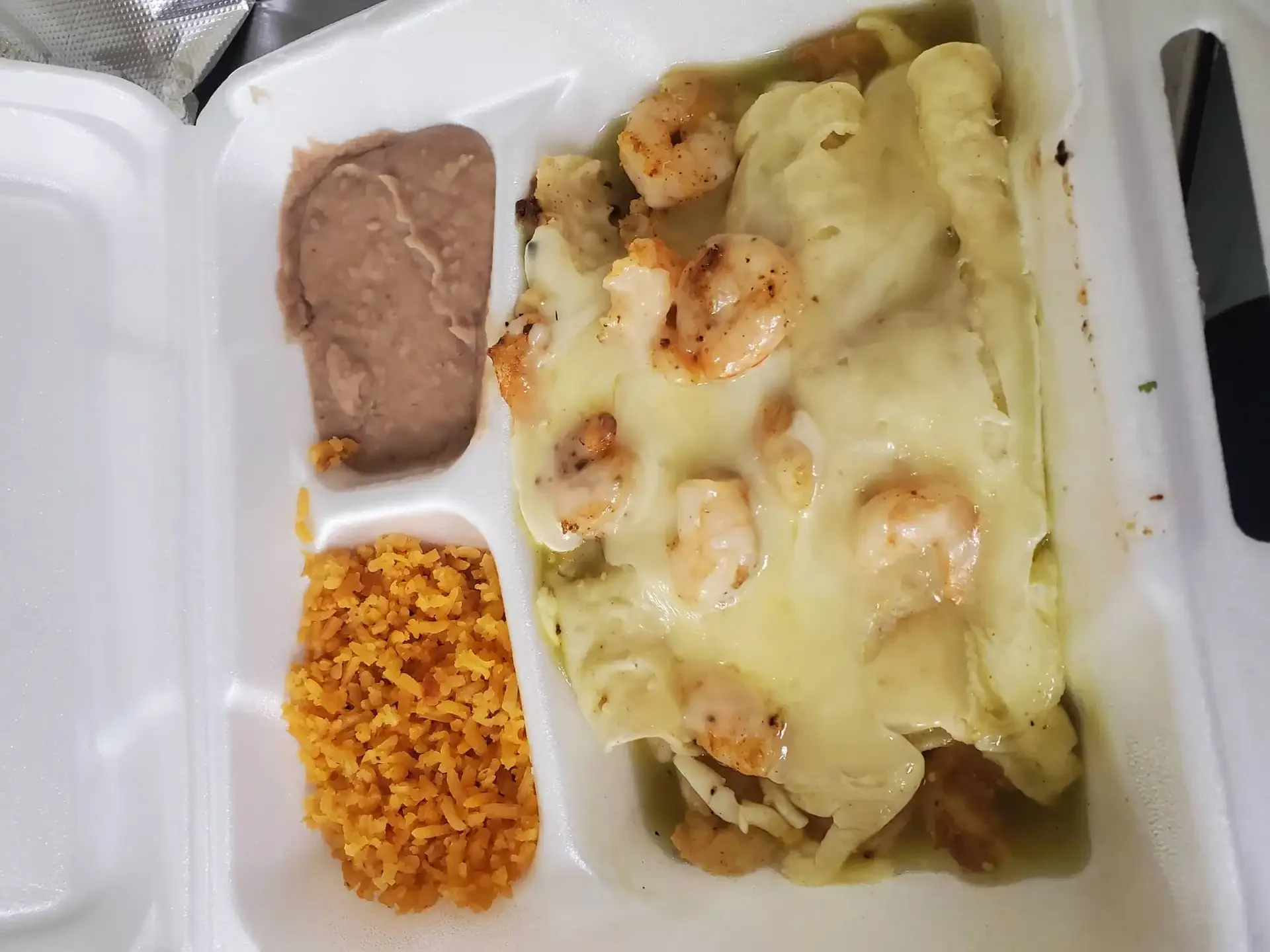 Shrimp Enchiladas - Tender shrimp wrapped in corn tortillas with green or red sauce