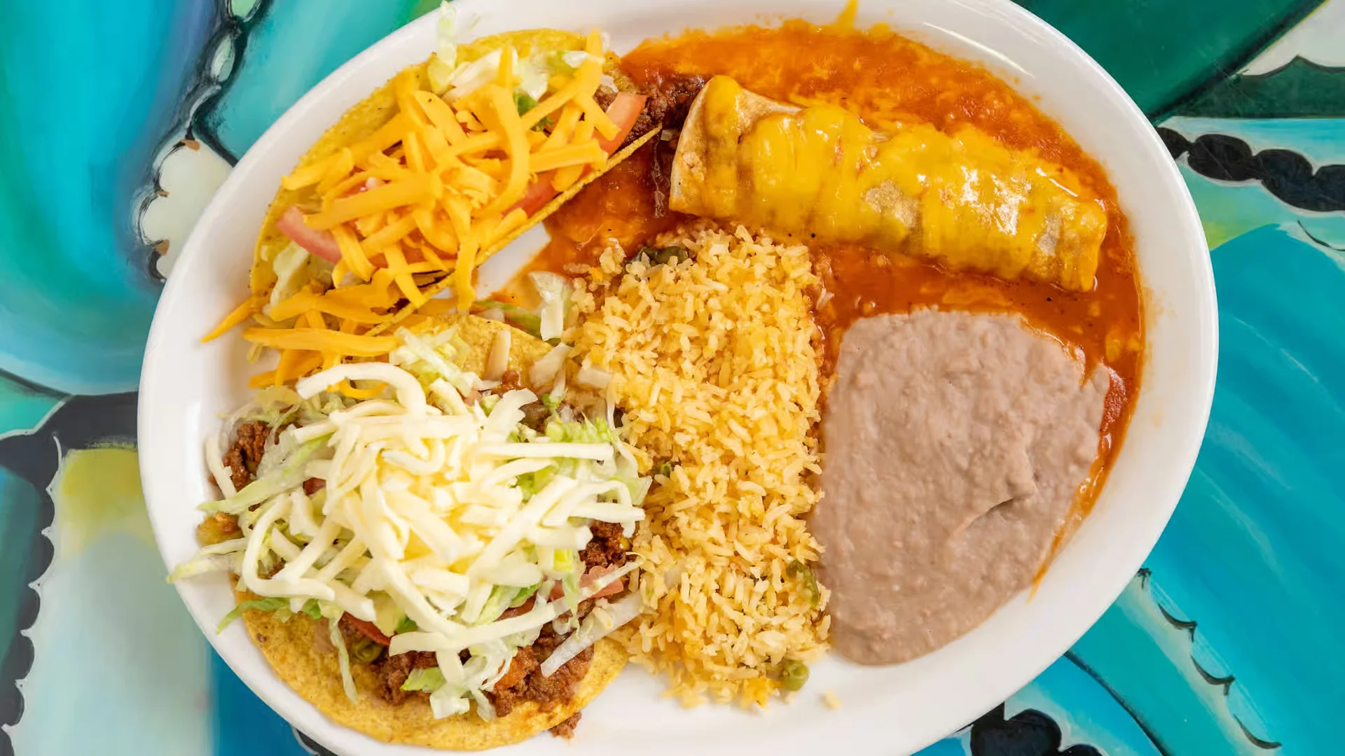 Tex-Mex Plate - A classic Tex-Mex combination with enchiladas, rice, beans, and more