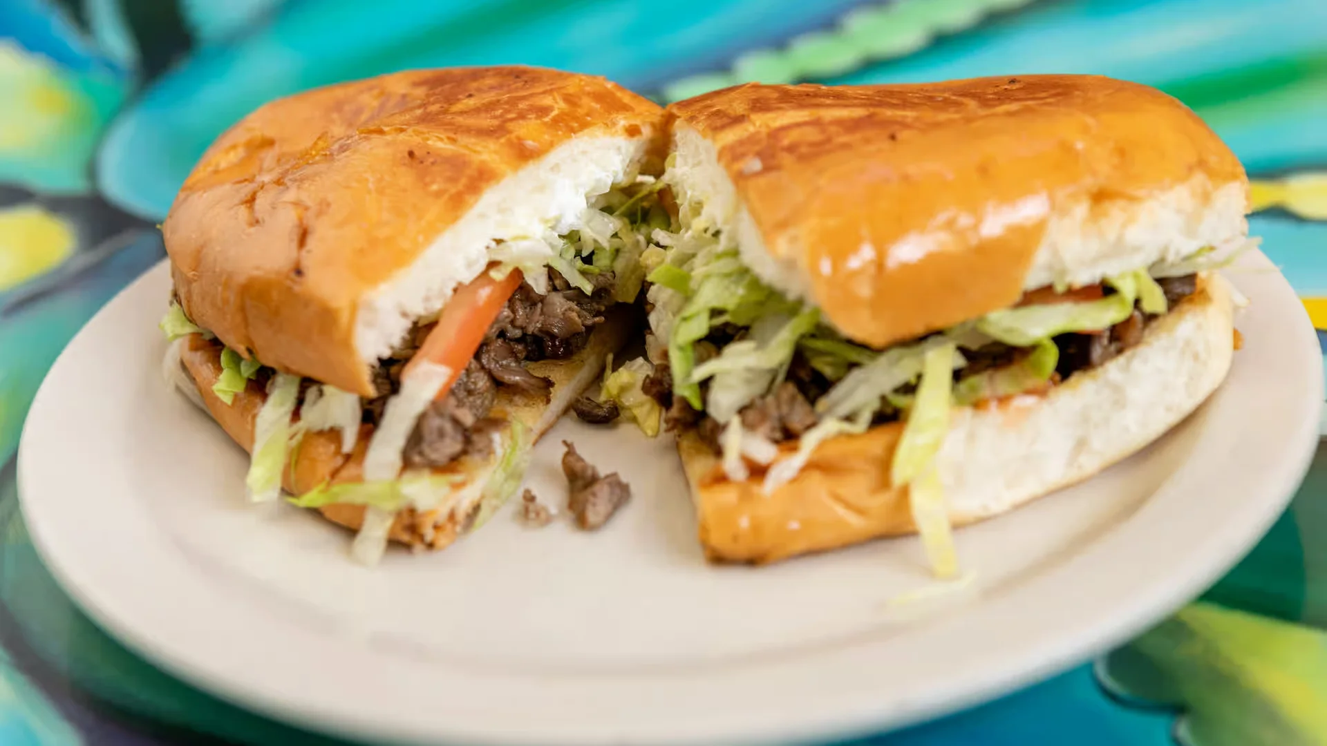 Torta - Mexican sandwich on a toasted bolillo roll with meat, avocado, and toppings